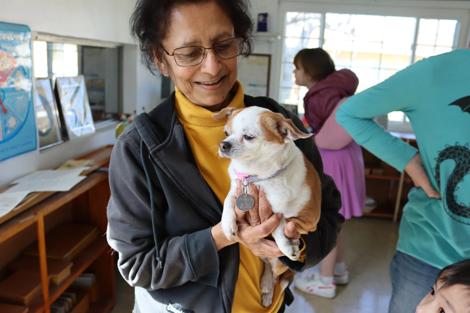 Teacher holding the school dog